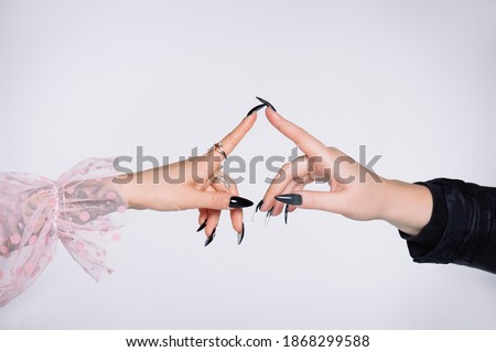 Connected two hands of two young girls lesbians isolated, white background. Breaking stereotype, new normal relationship
