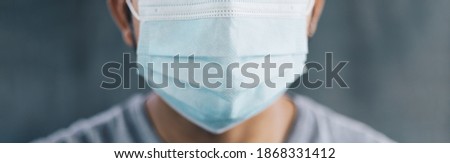 close up of Male wearing medical masks over gray background