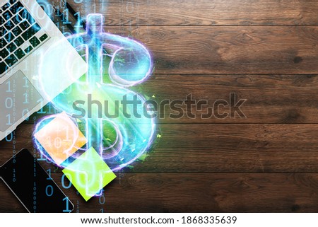 Image of a dollar hologram, on the background of a laptop top view. Business concept, electronic money, cryptocurrency. Mixed media