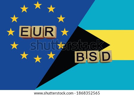 United Europe and Bahamas currencies codes on national flags background. International money transfer concept