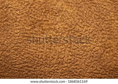 Wrinkled brown textile blanket as a background