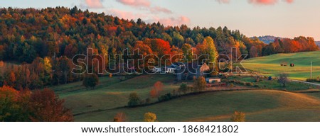 Beautiful Fall colors with farm house in New England in USA Royalty-Free Stock Photo #1868421802