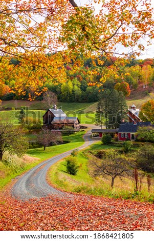 Beautiful Fall colors with farm house in New England in USA Royalty-Free Stock Photo #1868421805
