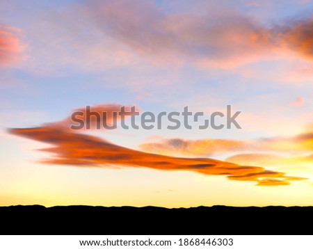 Vivid autumn sunset and odd cloud formations over Calf Creek, northern Grand Staircase Escalante, south central Utah Royalty-Free Stock Photo #1868446303