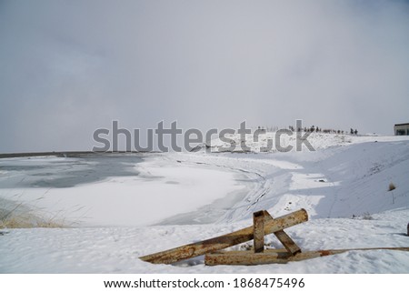 Frozen Lake And Snowy Peak