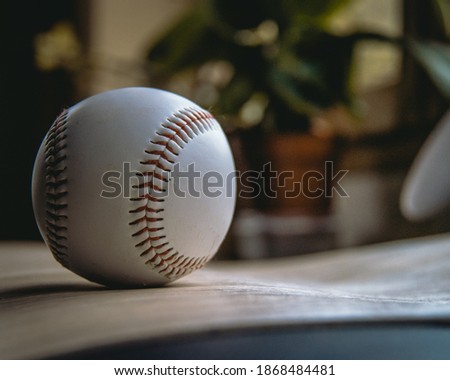 white and red baseball ball 