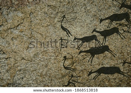 Hunting scenes palaeolithic Petroglyphs carved in rocks. Hunters on animal. Stones with petroglyphs. Ancient people.