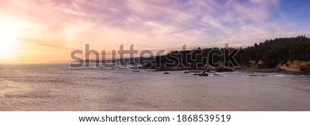 Beautiful Panoramic View of Lincoln Beach on the Pacific Ocean Coast during a cloudy summer day. Taken in Boiler Bay State Scenic Viewpoint, Oregon, United States. Colorful Sunset Sky. Royalty-Free Stock Photo #1868539519