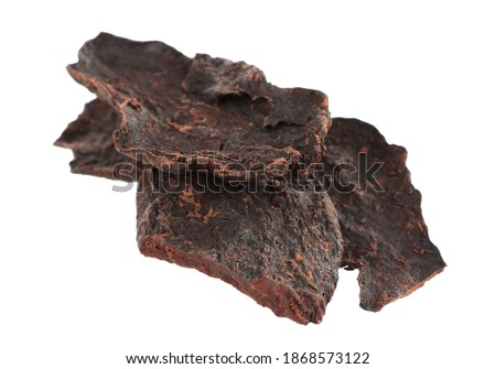 He Shou Wu Fo-Ti Dry Root (Polygonum Multiflorum). Black Bean Cured All Purpose Herb. Isolated on White. Royalty-Free Stock Photo #1868573122