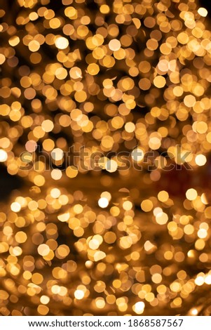 golden bokeh illumination lighting Christmas garland lamps unfocused effect vertical concept wallpaper picture