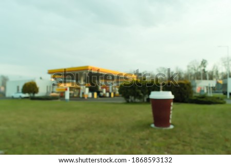 blurry view of a gas station. Blurry photo of a petrol station.