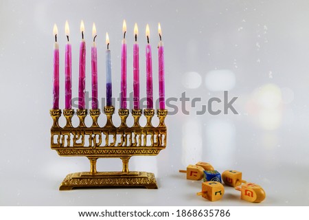 Jewish lights holiday of chanukah a burning menorah symbol of Judaism traditional jewish holiday