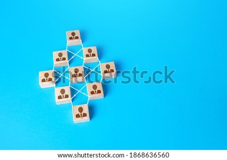 Connected people blocks on blue background. Concept of order, orderliness and uniform structure. Team building. Employee network. Human resource management, hiring and staffing. management strategies Royalty-Free Stock Photo #1868636560