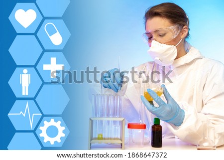 Microbiologist. Biologist works in laboratory. Laboratory assistant with test tubes in hands. Microbiological studies. Laboratory assistant examines living microorganisms. Creation of probiotics.