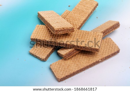 chocolate wafer biscuits isolated on color background
