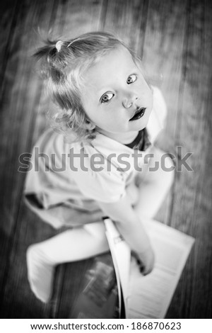 Little girl read magazine - black and white image
