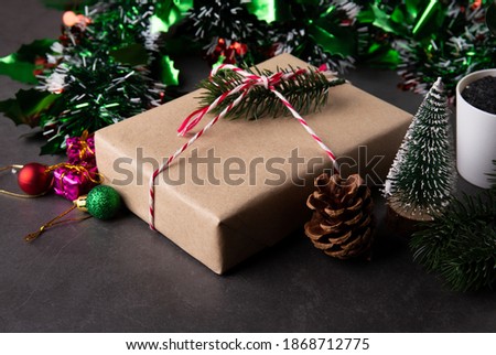 Christmas holiday composition with gift box and decoration, new year and xmas or anniversary with presents on cement floor background in season, top view.