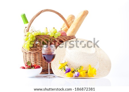 picnic basket with fruit bread and wine. 