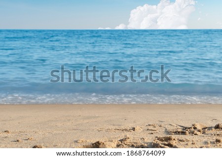 Beautiful pictures of beaches close-up center of sand. With blue sea on a clear day of sky and clouds.