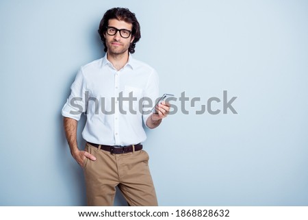 Photo of young arabian handsome businessman confident use cellphone chat type isolated over grey color background
