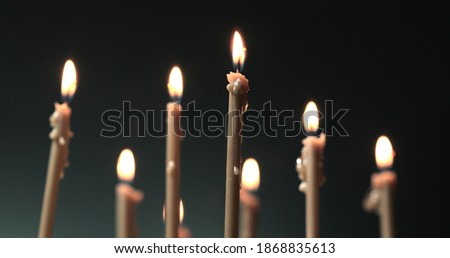Candles burning on a church altar. Burning a candles on blurred background