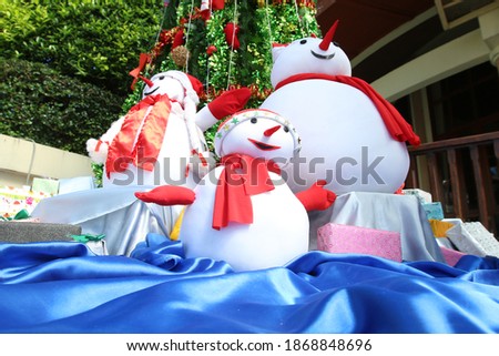 snowman with christmas tree background