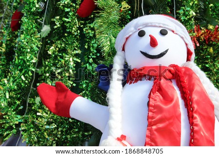 snowman with christmas tree background