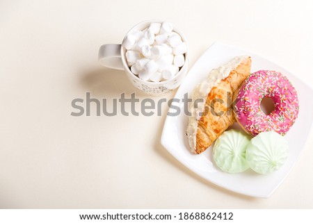 
Croissant donut and marshmallows on white background