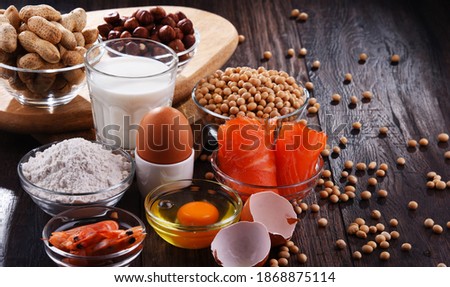 Composition with common food allergens including egg, milk, soya, peanuts, hazelnut, fish, seafood and wheat flour Royalty-Free Stock Photo #1868875114