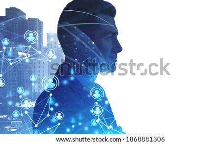 Portrait of confident young businessman standing in blurry city with double exposure of HR interface. Toned image mock up