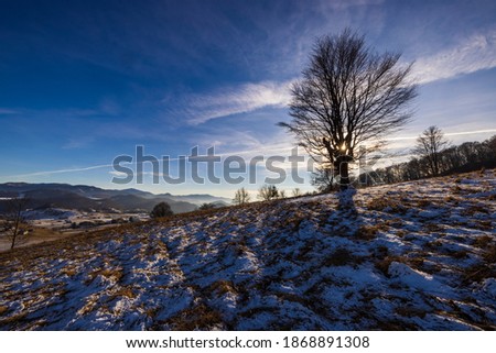 Beautiful mountain landscape in the Carpathian Mountains Romania at the transition from autumn to winter.
