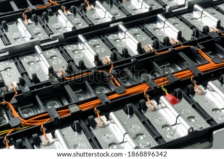 Selective focus of Electric car lithium battery pack and wiring connections internal between cells on background.	 Royalty-Free Stock Photo #1868896342