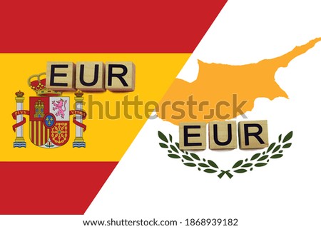 Spain and Cyprus currencies codes on national flags background. International money transfer concept