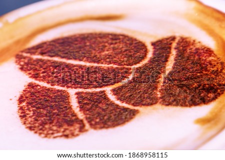 Cup of cappuccino close-up with coffee bean picture
