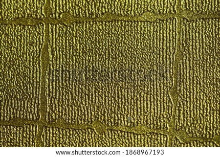 yellow gold color on a rough surface texture background. Image photo