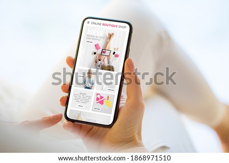 Woman shopping online on her mobile phone Royalty-Free Stock Photo #1868971510