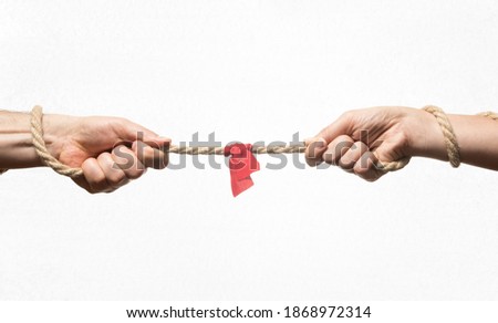 A man and a woman are tug of war. Concept. Royalty-Free Stock Photo #1868972314