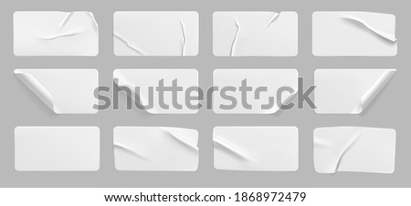 Crumpled white rectangle sticker label set isolated. Blank glued adhesive paper or plastic sticker with wrinkled effect and curled corners. Label tags template for door or wall. 3d realistic vector Royalty-Free Stock Photo #1868972479
