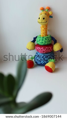 Children's toy giraffe on a white background