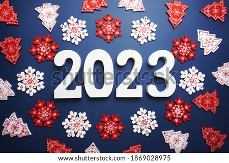 Happy New Year 2023 alphabet letter with Christmas decoration on blue background