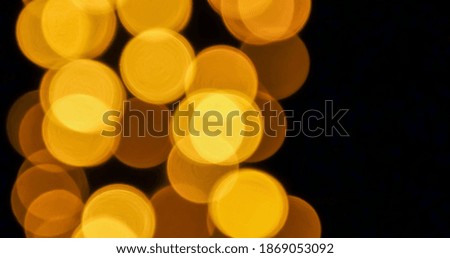 Blurred image of golden light decoration in a city for Christmas season