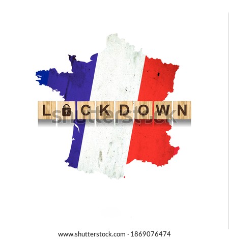 Lockdown. France. The inscription on wooden blocks, against the background of the map of France. Closing the country to quarantine. Isolated. Pandemic.