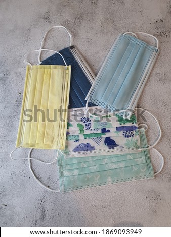 Different colours and size of 3ply disposable face mask. all the mask follow NIOSH and CE standard Royalty-Free Stock Photo #1869093949