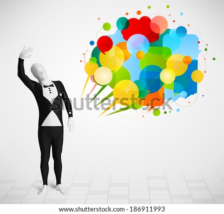 Strange funny guy in morphsuit looking at colorful speech bubbles