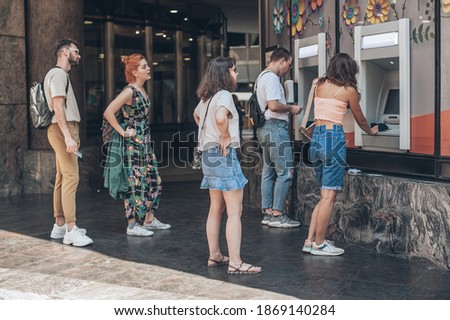 Line to ATM. Group of people waiting to withdraw money to bank card using ATM cash machine. Bank service. Finance, transactions, credit card, money withdraw, currency concept Royalty-Free Stock Photo #1869140284