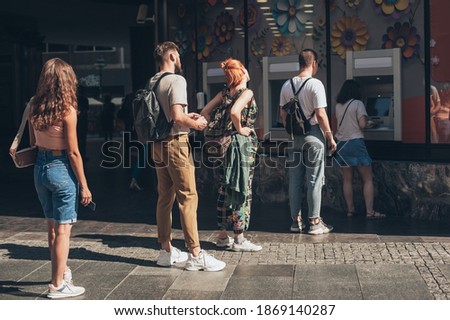 Line to ATM. Group of people waiting to withdraw money to bank card using ATM cash machine. Bank service. Finance, transactions, credit card, money withdraw, currency concept Royalty-Free Stock Photo #1869140287