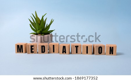 Mediation Word In Wooden Cube on blue .