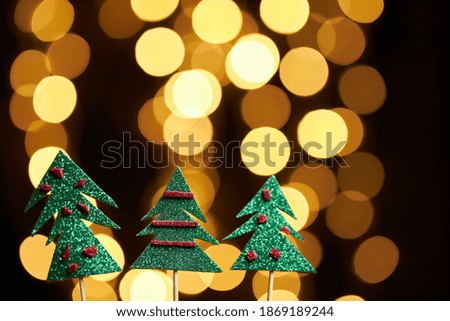 Shiny Christmas trees on bokeh background. New Year. New Year mood, Christmas, greeting card, New Year background.
