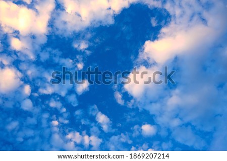 Sky background with fluffy white clouds.