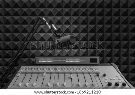 Background with professional microphone and sound mixer